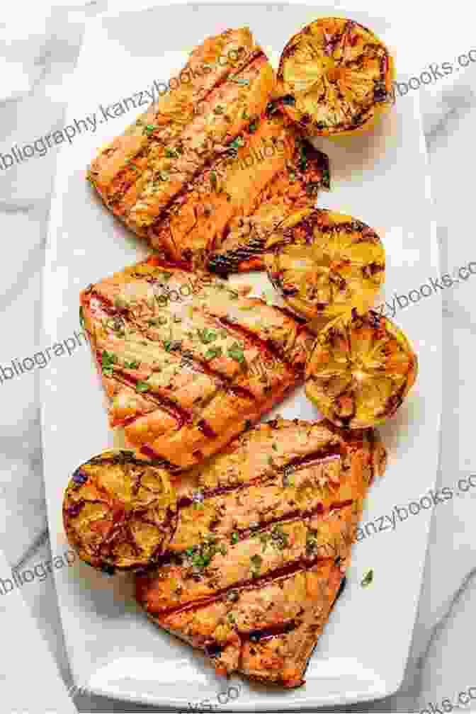 Grilled Salmon Fillet Topped With Lemon Slices And Fresh Herbs. OUTDOOR GRILLING RECIPES: Main Dish Recipes For BBQ Camping